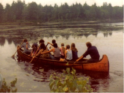 24' Fur-Trade era birchbark canoe built in 1974 by Vaillancourt in the style of the Algonquin of northwestern Quebec ; shown with 11 people on board and a draft of 8''