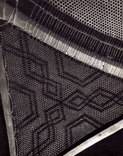 The tail weave of an old pair of highly finished Attikamek snowshoes.The woven designs have been traced over with black paint to highlight them , a technique used by other tribes as well ; often the woven designs are left unpainted.Note also the double space in the midsection weave at the tail crossbar , a technique peculiar to the Attikamek ; from ''Making the Attikamek Snowshoe'', photo courtesy of the Lower Ft. Garry National Historic Park