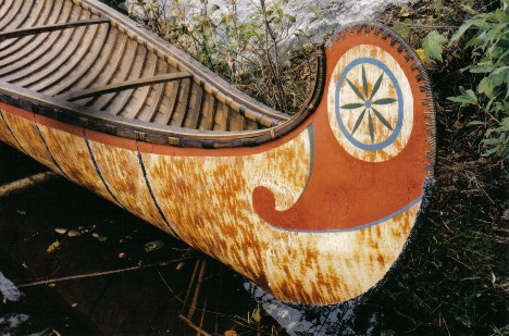 Decorative root sewing on bow of 18' fur-trade type birchbark canoe with typical painted ends ; made by Henri Vaillancourt 2004   