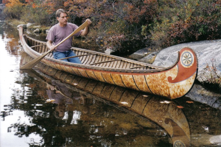 18 foot Fur-Trade style birch bark canoe  with typical painted  decoration and fancy root sewng on bows . This type  of bark canoe was built from the 1600's to the early 1900's  by both Indian and French craftsmen for Canadian government and military purposes ,as well as  for the fur-trade