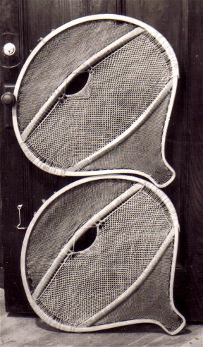 Old Montagnais beavertail snowshoes of an extremely  wide pattern in the Chateau de Ramezay in Montreal . Some snowshoes of this type are even wider than this pair, having widths that exceed the length by as much as 1 1/2 '' ; photo Henri Vaillancourt  1973