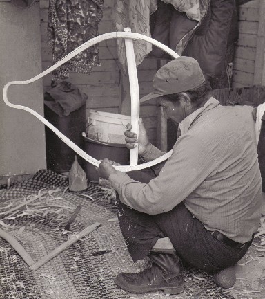 Sam Rabbitskin installing the crossbars in a new pair of beavertail snowshoes, Mistassini , Quebec 1977; from the video ''Beavertail Snowshoes'' ; photo Henri Vaillancourt