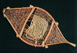 A very fine example of Attikamek Indian snowshoe, circa early 1900's . The end sections are woven with complex geometric patterns and the midsection features the fancy ''double selvage cords'' ; from ''Making the Attikamek Snowshoe'' ; photo -courtesy of Lower Fort. Garry National Historic Park